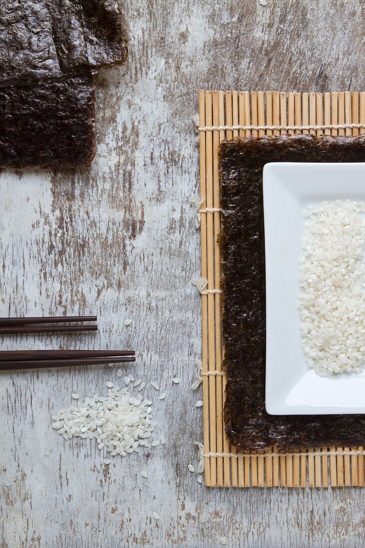 Ingredients for sushi on a bamboo mat