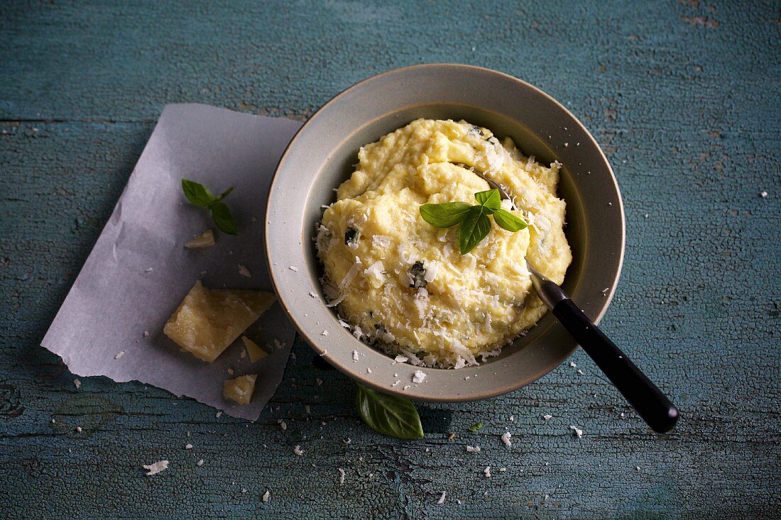 Polenta with basil and grated Parmesan cheese