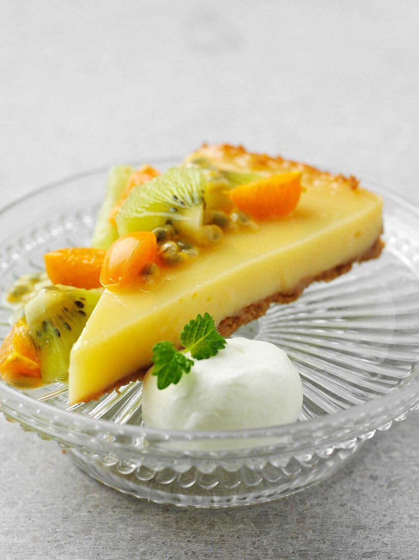 A slice of lemon curd cake with exotic fruit