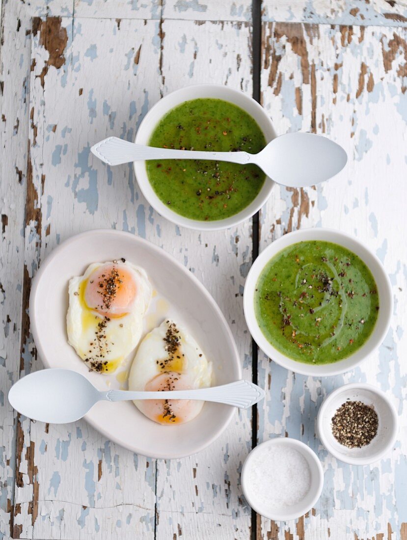 Watercress soup and poached eggs with pepper