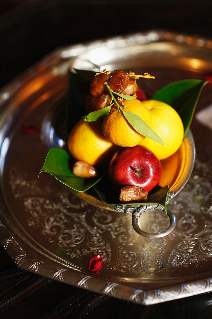 A fruit platter with lemons, apples and date, Marrakesh, Morocco