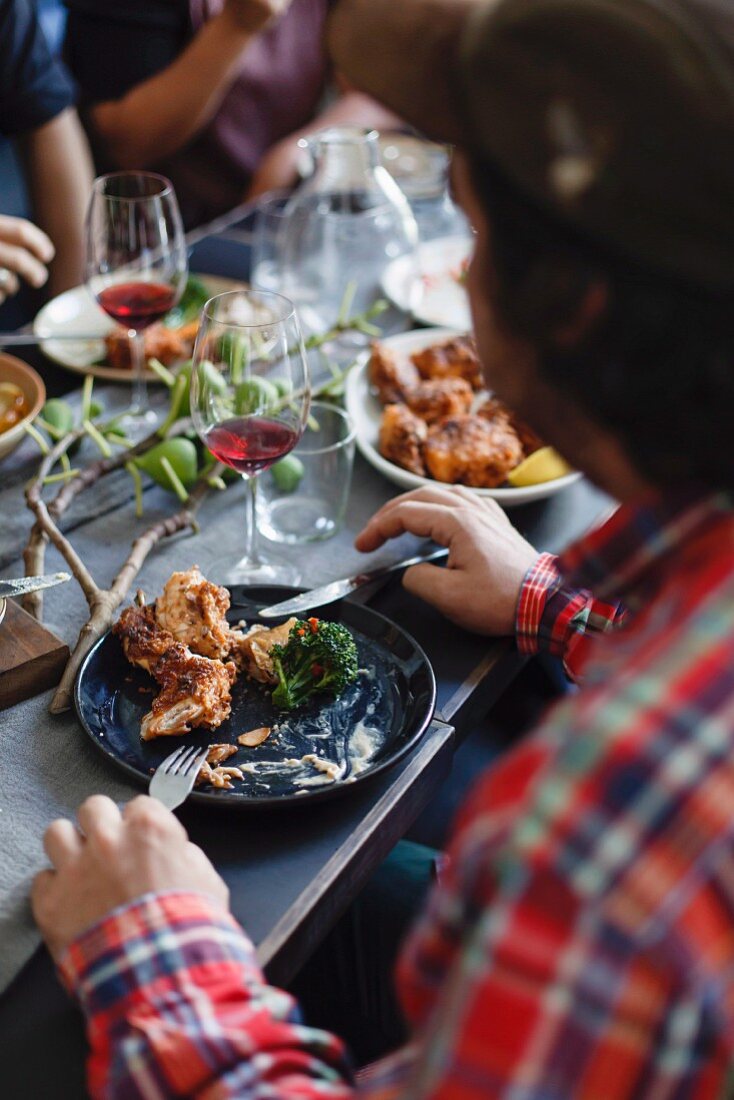 Man eating fried rabbit