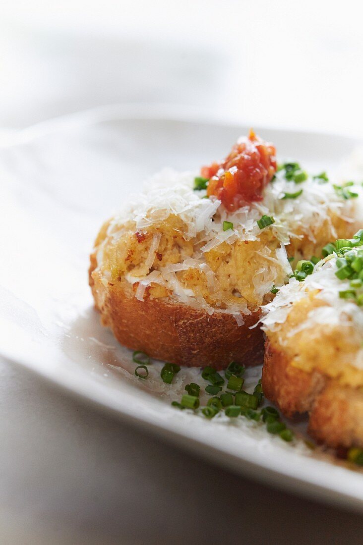 Bruschetta topped with cheese and chives