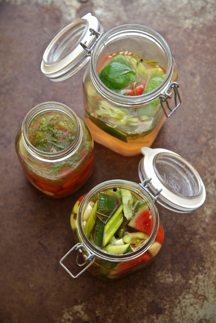 Pickled vegetables from Russia (watermelon, cucumber, celery, tomatoes, garlic, dill) in jars