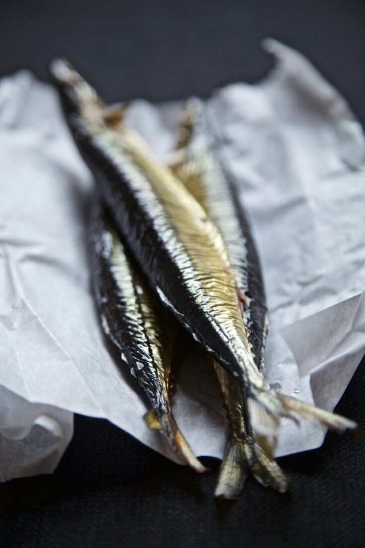 Smoked herring from Russia on a piece of paper