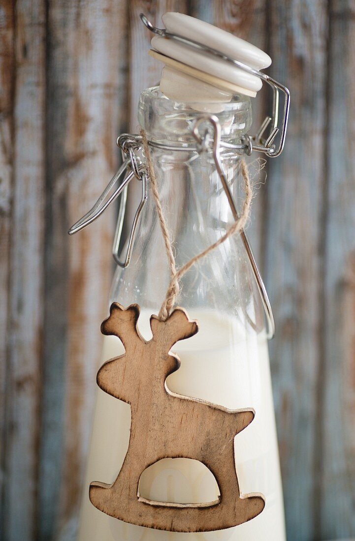 Reindeer pendant on milk bottle