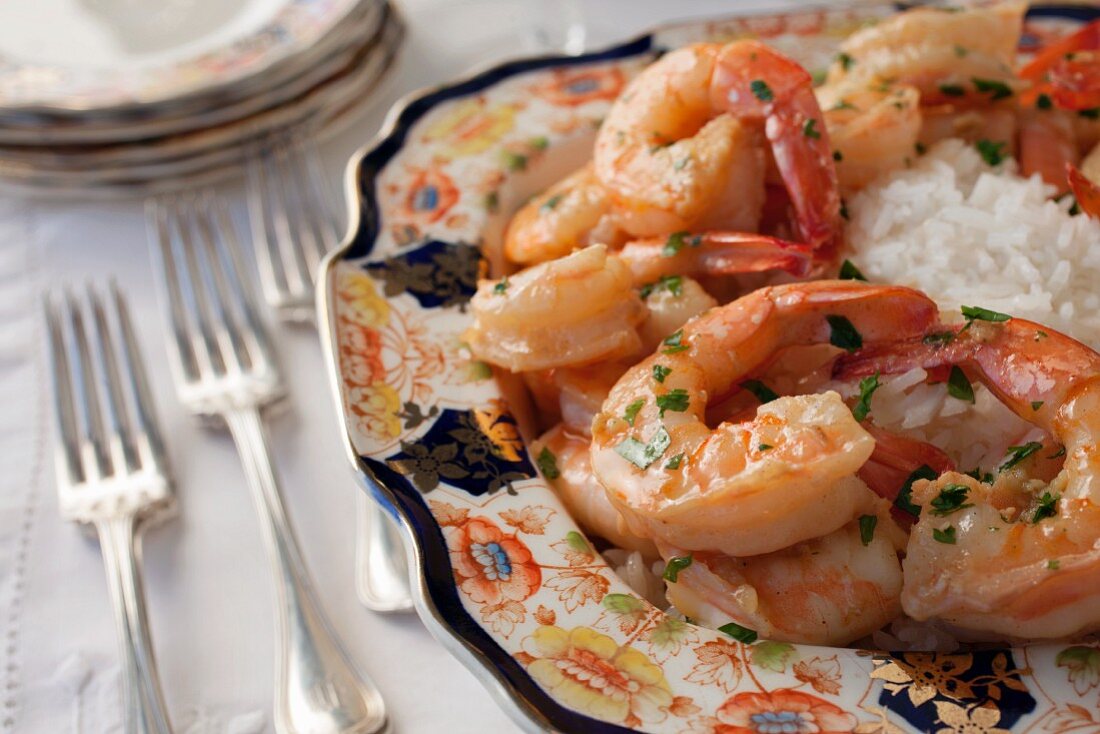 King prawns with herbs and rice on a Chinese porcelain plate