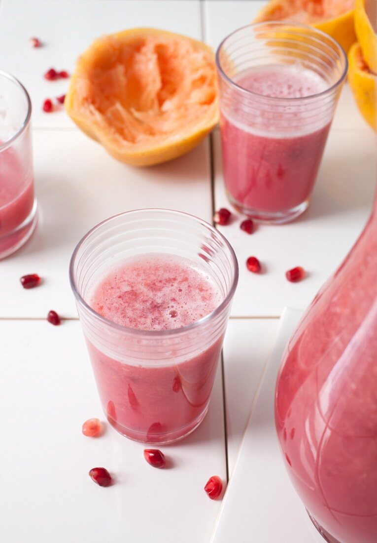 Glasses of freshly pressed grapefruit and pomegranate juice
