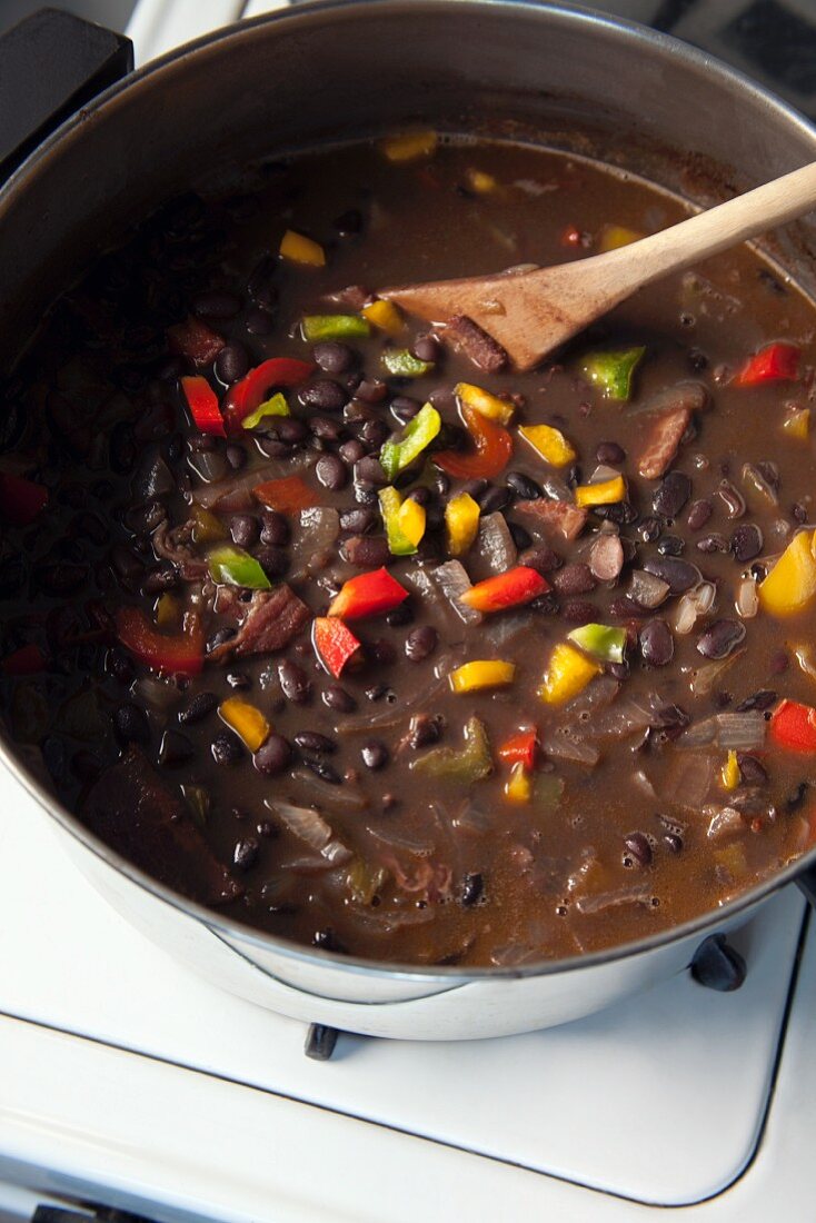 Black bean stew with chipotle in a pot on a stove