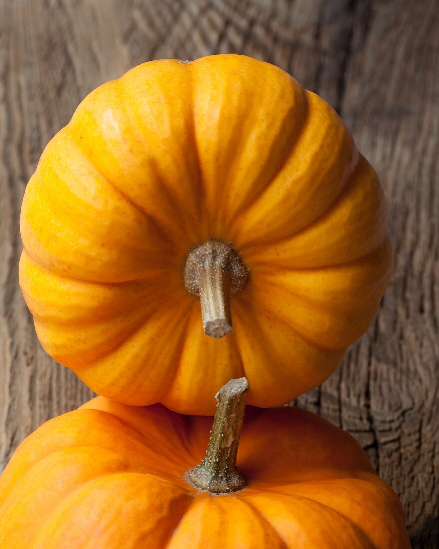 Pumpkins on a wooden surface