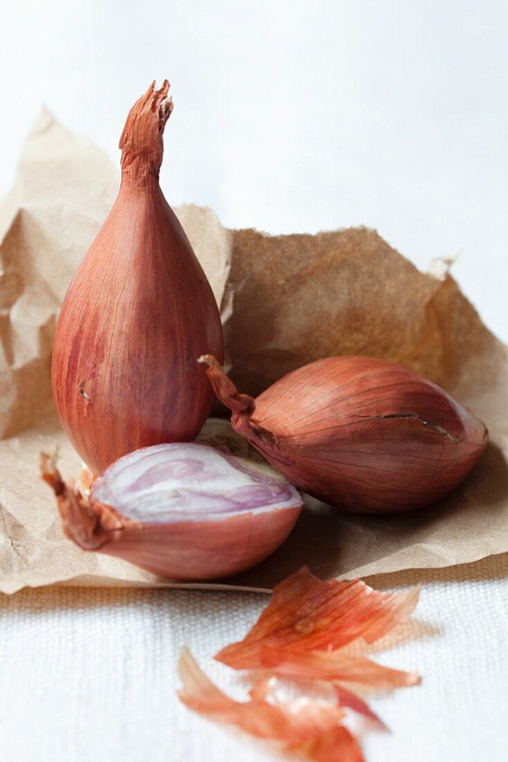Shallots on brown paper