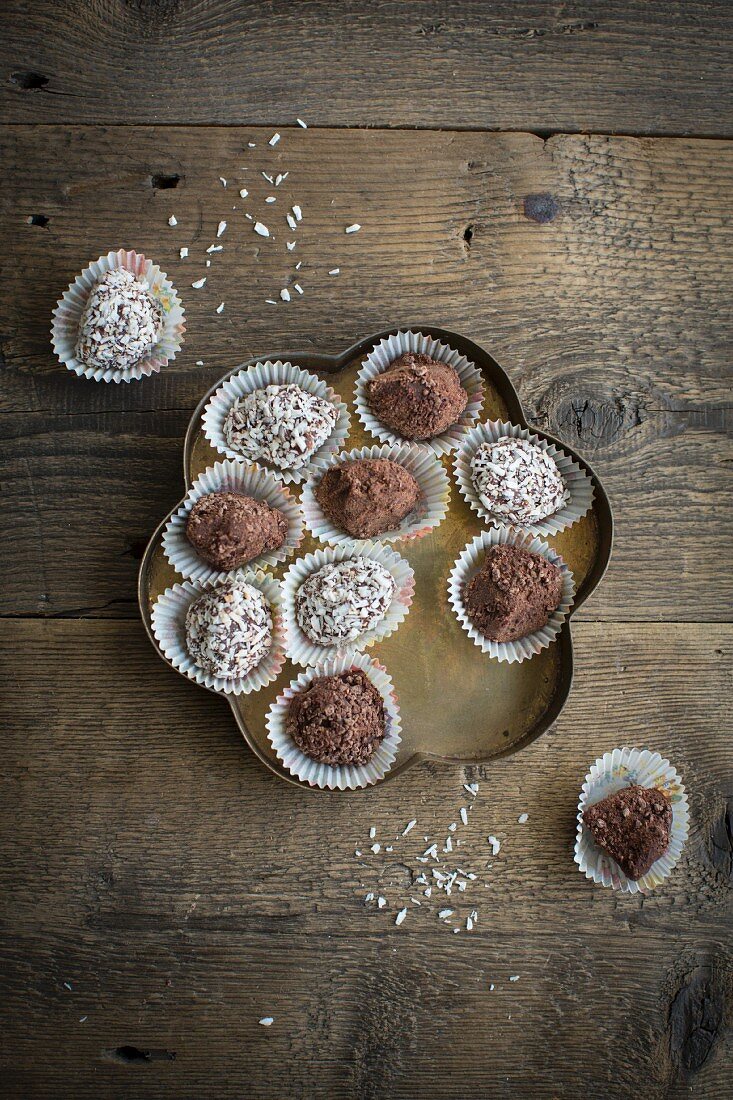 Chocolate spread truffles with cocoa powder and grated coconut