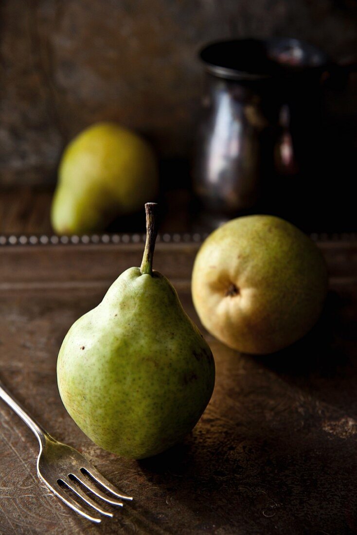 Three pears on a metal tray