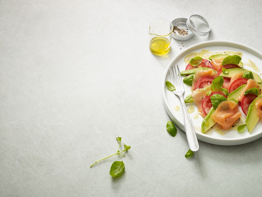 Avocado salmon caprese with fresh basil (Paleo diet)