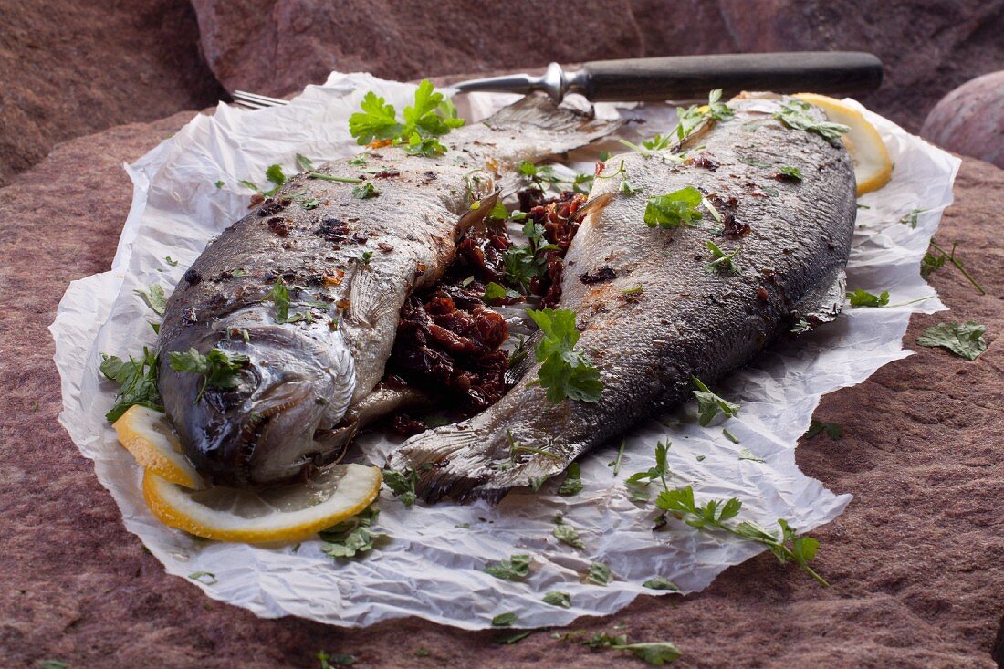Fried trouts filled with dried tomatoes