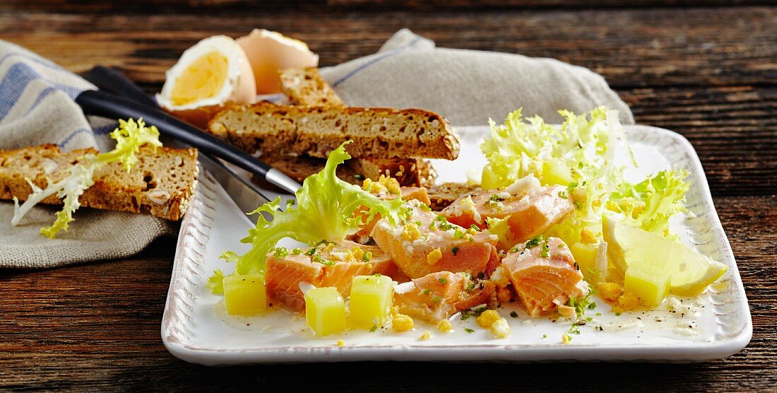 Char salad with potatoes and frisee lettuce