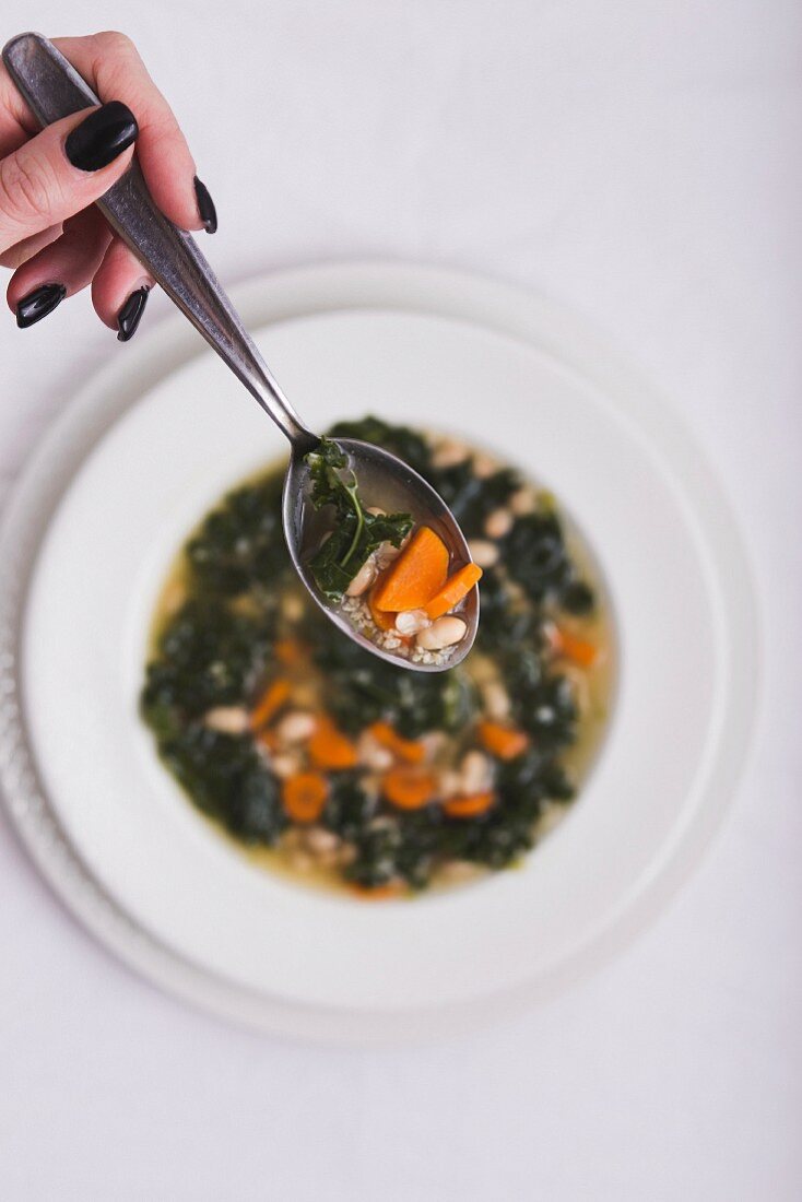 Kale soup with carrots and beans