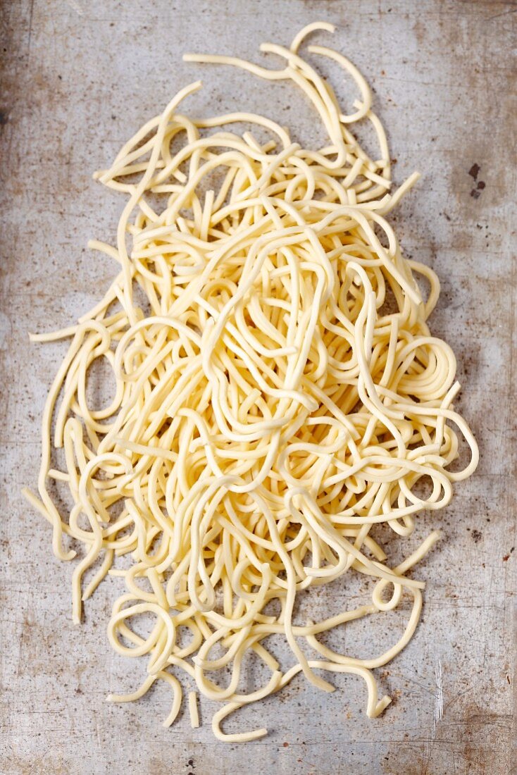 Fresh, uncooked spaghetti