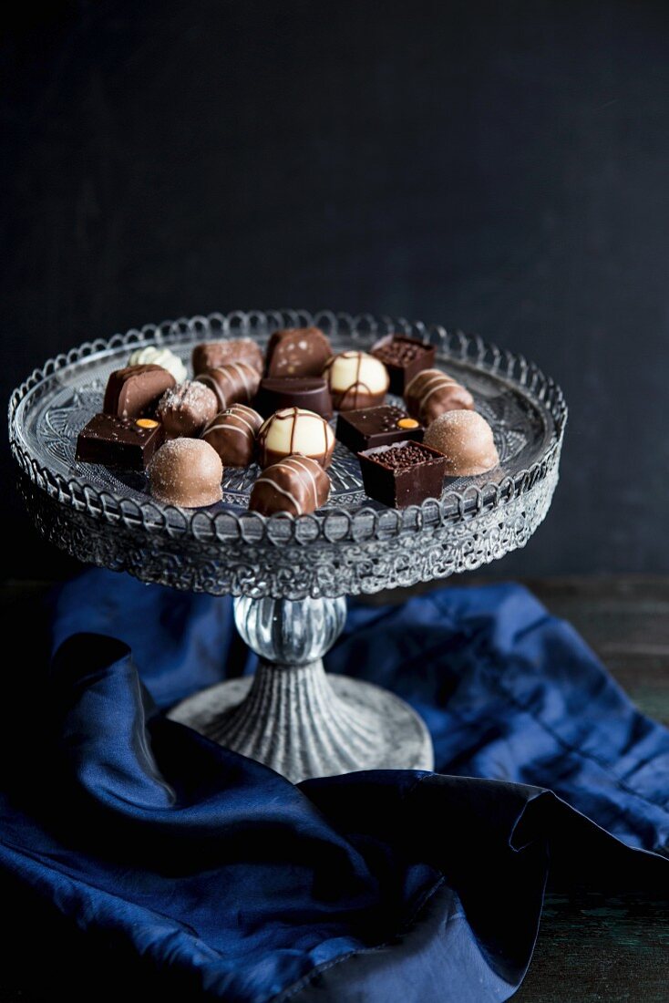 Various pralines on a vintage cake stand