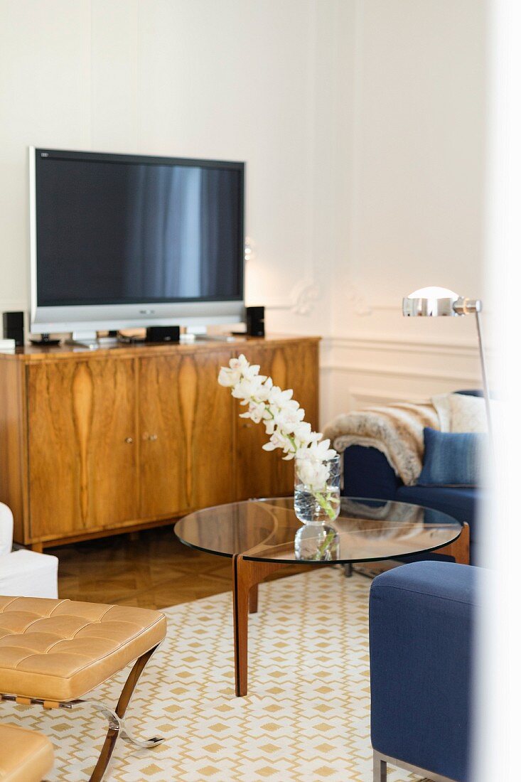 Veneer sideboard and round coffee table in retro living room