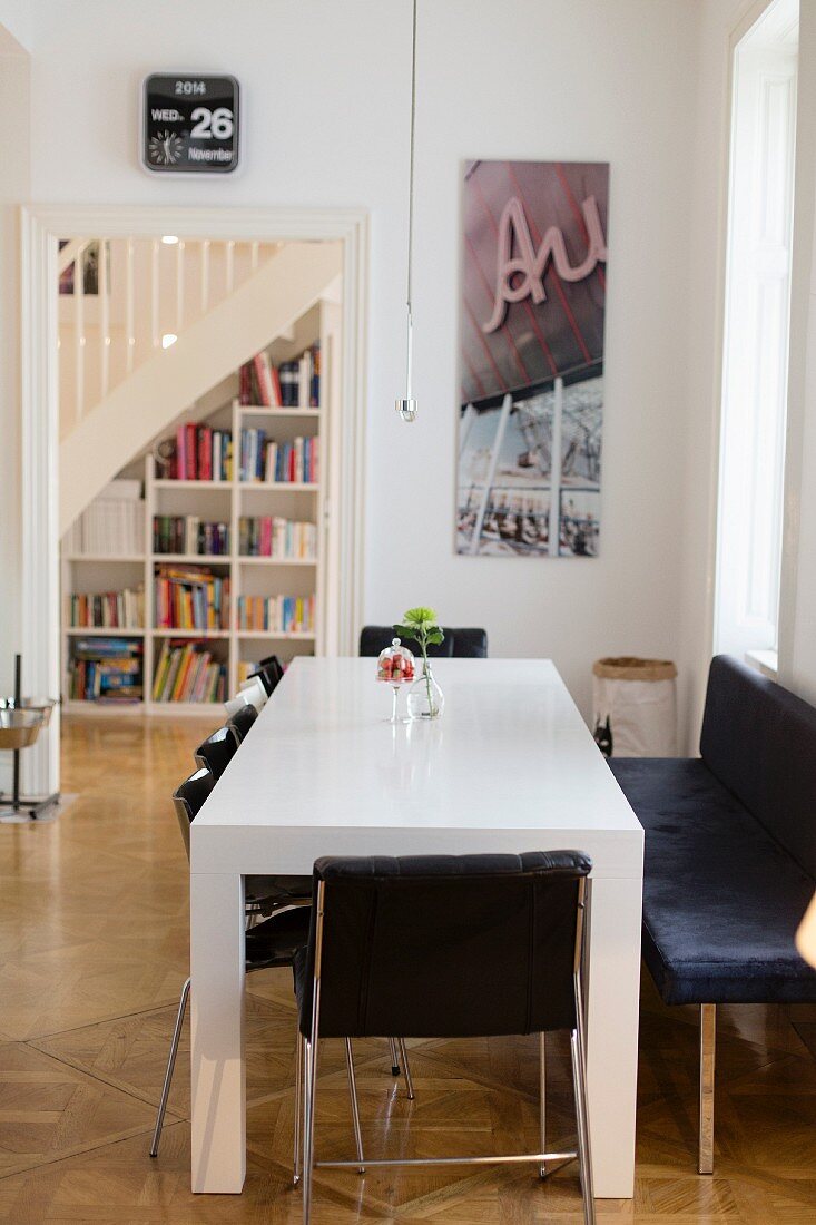 White dining table and black chairs