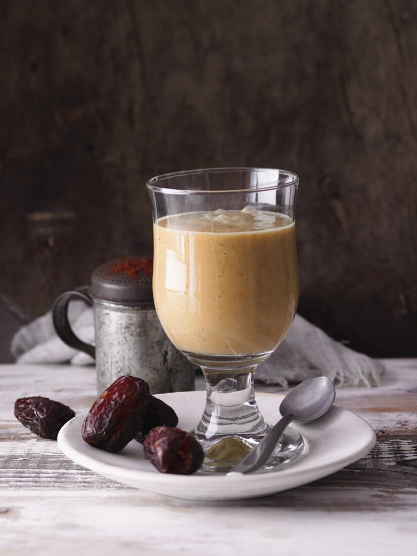 A date and orange smoothie with avocado and cocoa