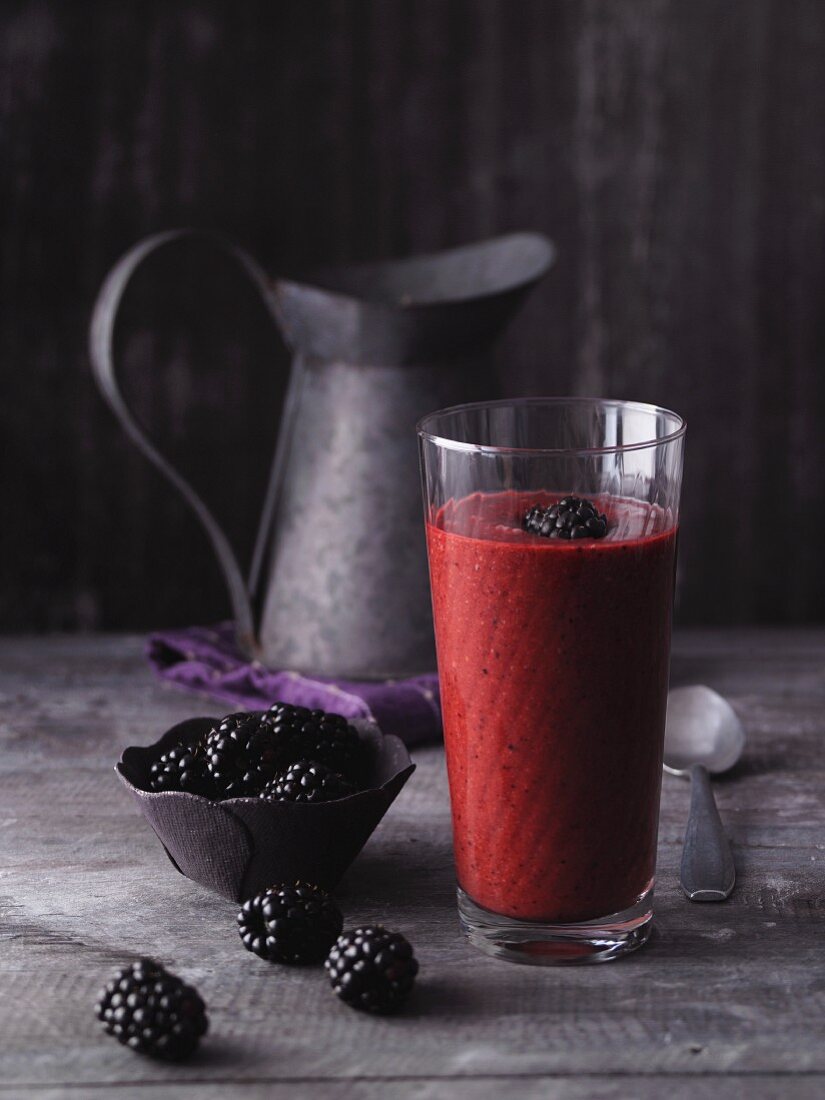 A plum and blackberry smoothies with an almond drink and acai powder