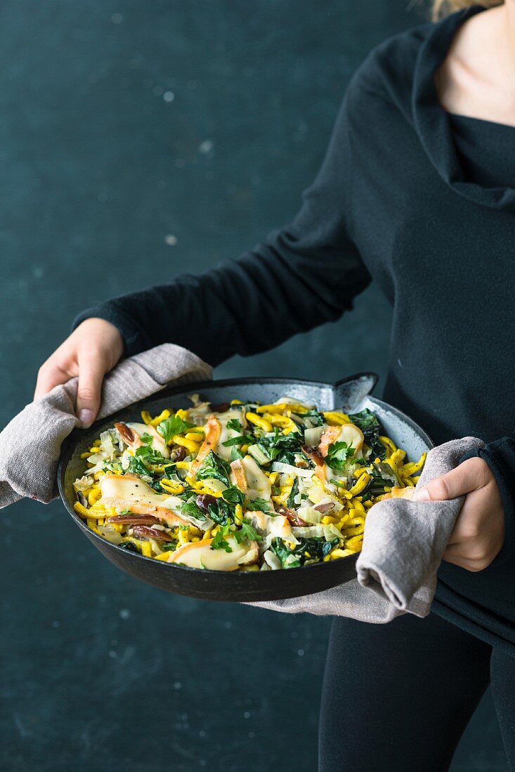 Fried cheese pasta with chard, dates and Taleggio cheese