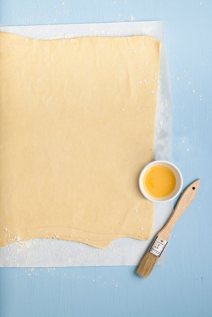 Puff pastry on a piece of parchment paper