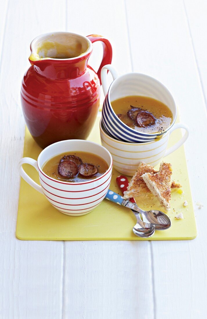 Butternut squash soup with sausage and toast