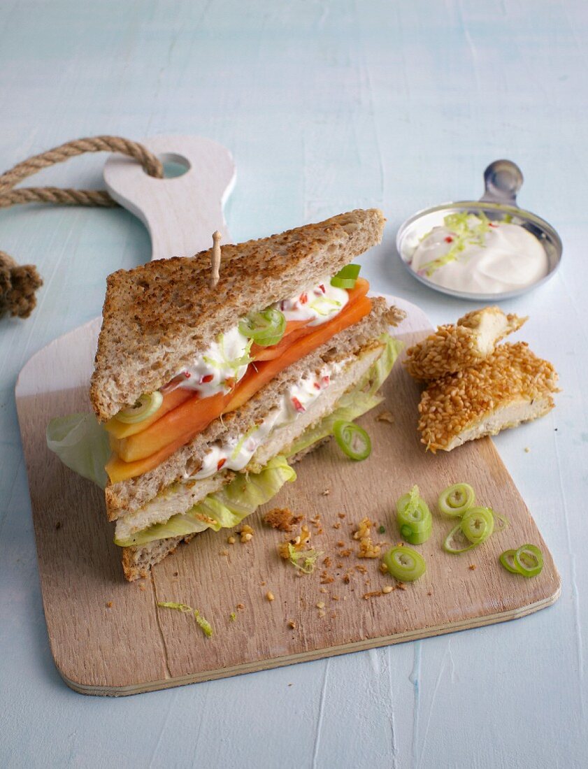 A wholemeal club sandwich with chicken