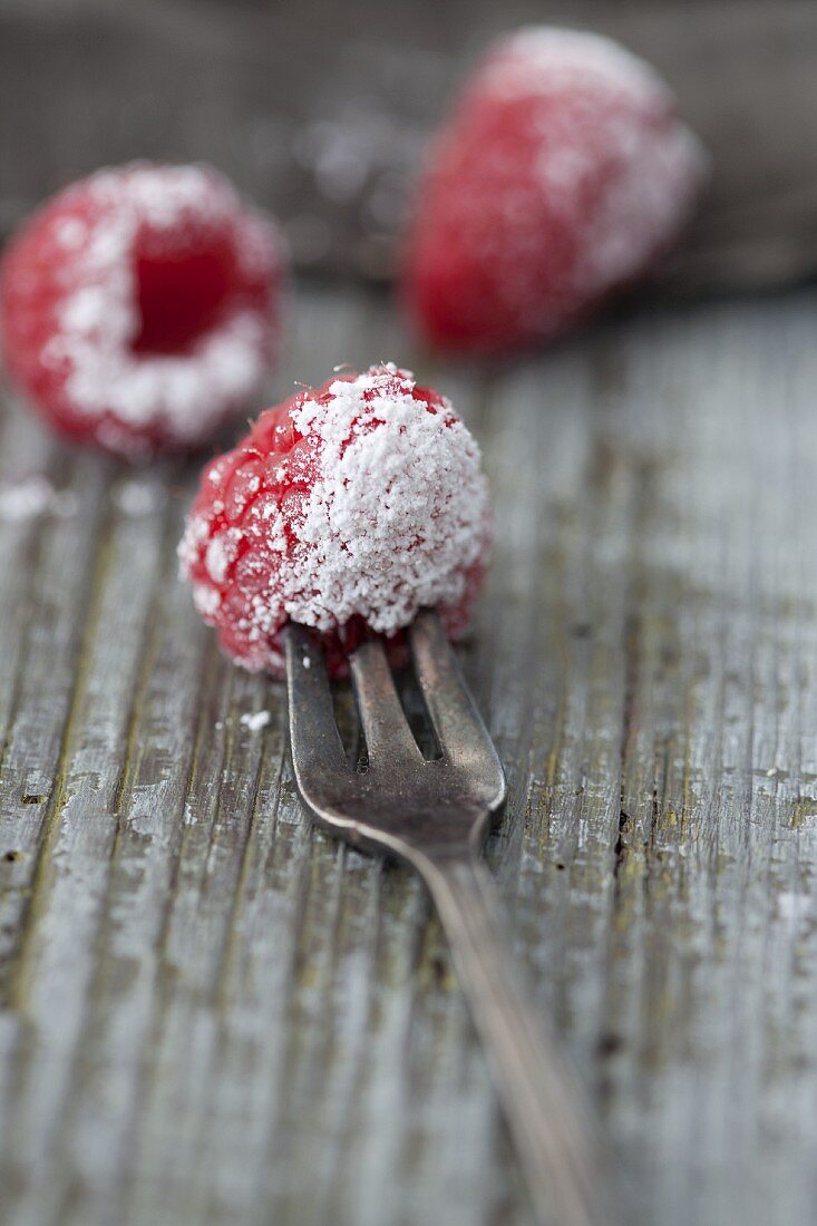 Raspberries with icing sugar