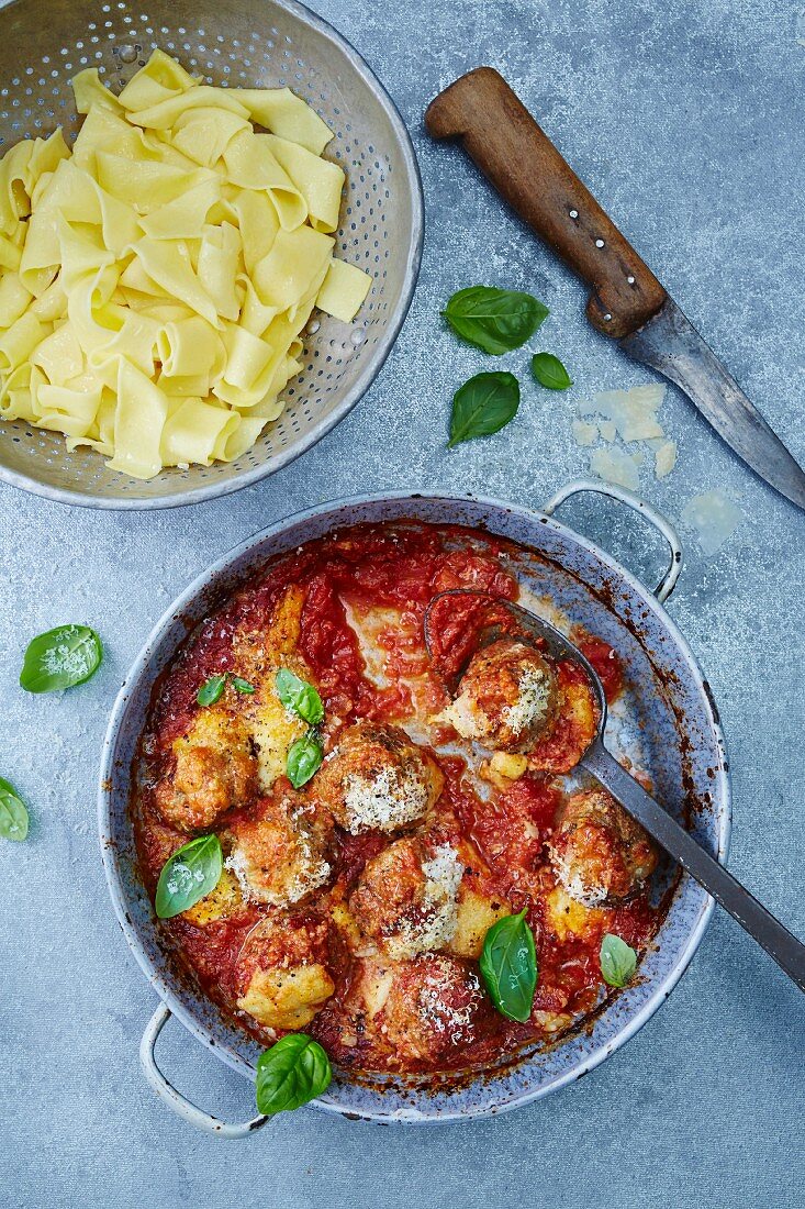 Lamb meatballs with cheese and tomato sauce served with tagliatelle