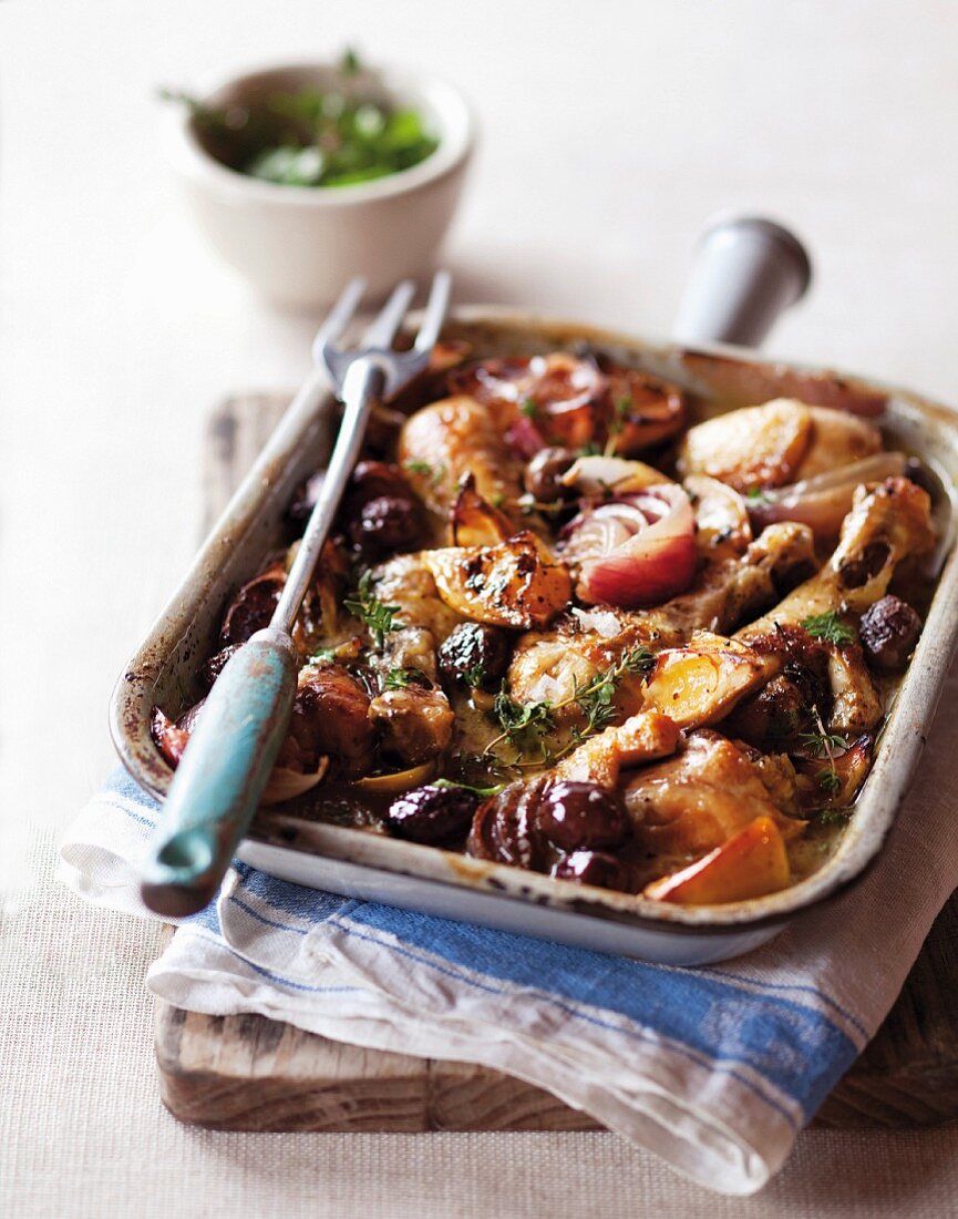 Oven-baked chicken with red onions and olives