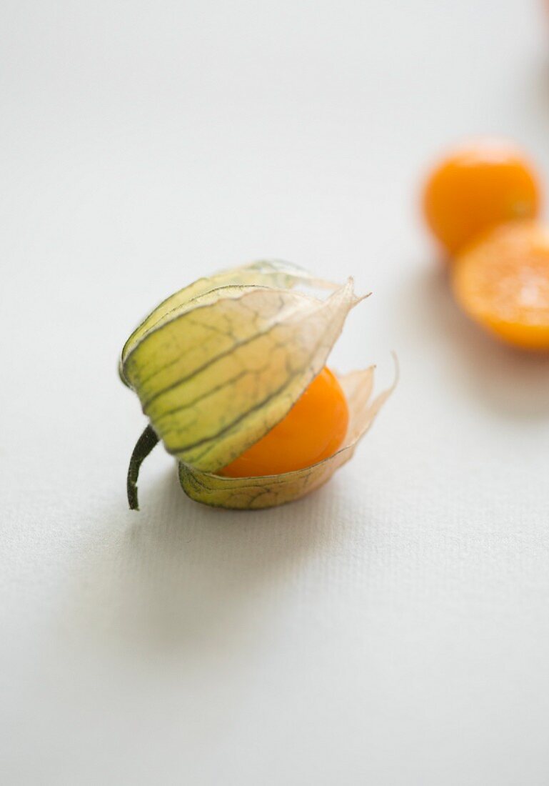 A close-up of a physalis in a half-opened shell