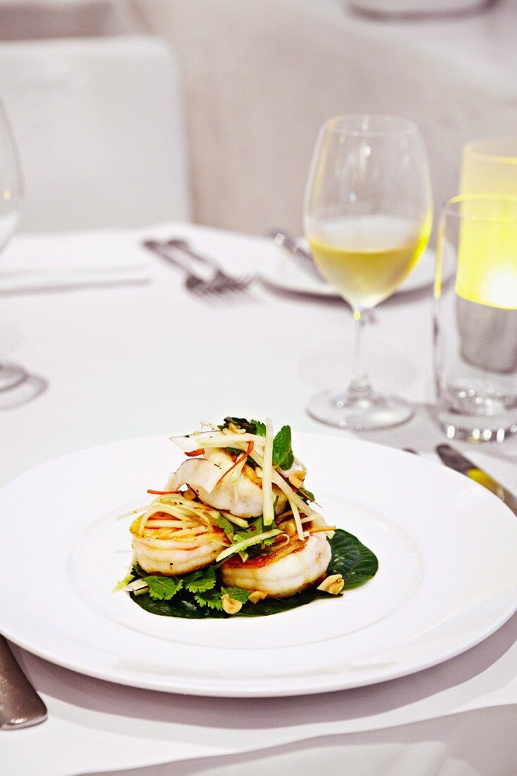 Fried king prawns with peanuts and coconut chips