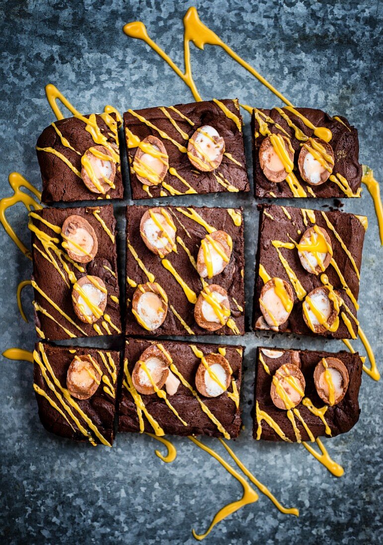 Chocolate brownies with mini Easter eggs and yellow icing