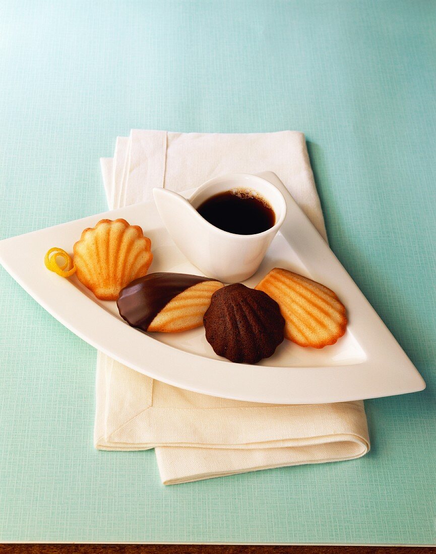 Various madeleines with a cup of coffee