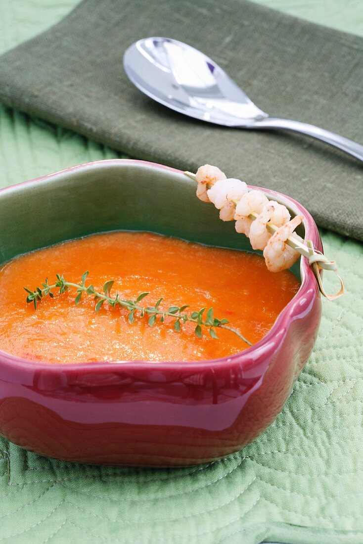 Tomato and ginger soup with a prawn skewer