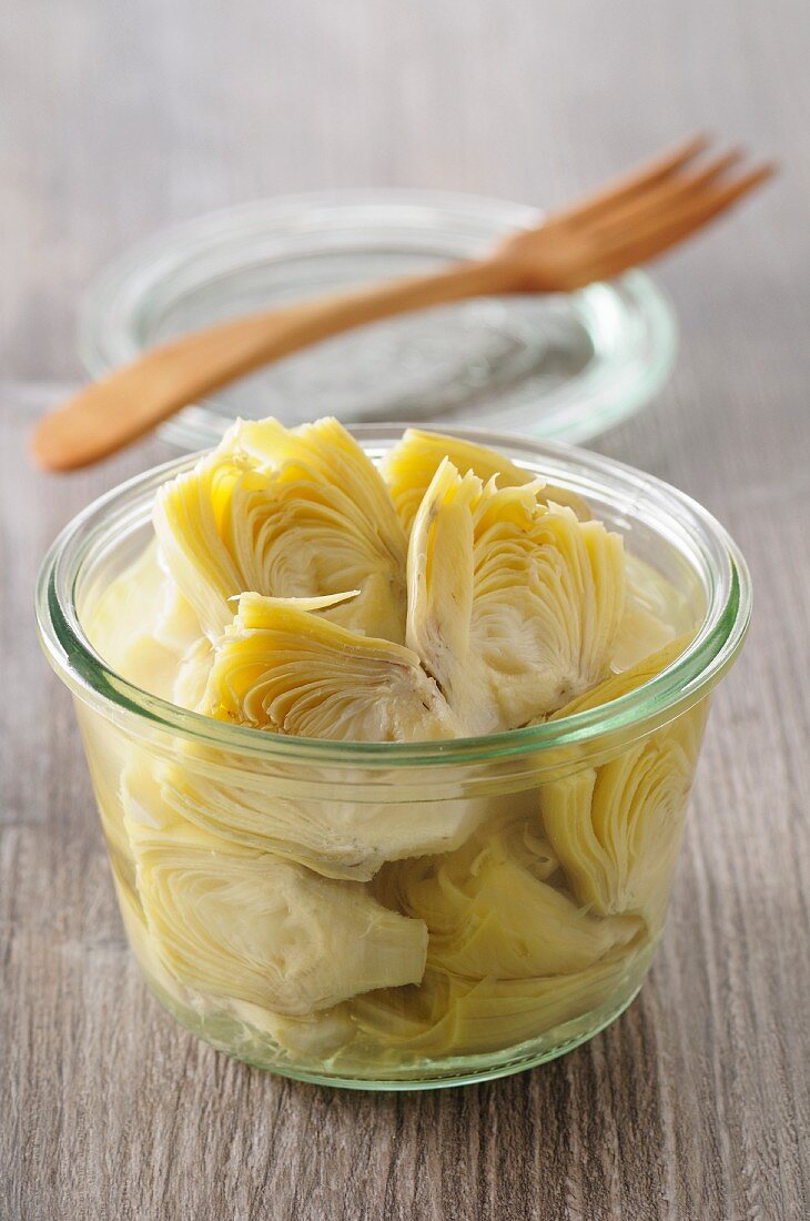 A jar of pickled artichoke hearts