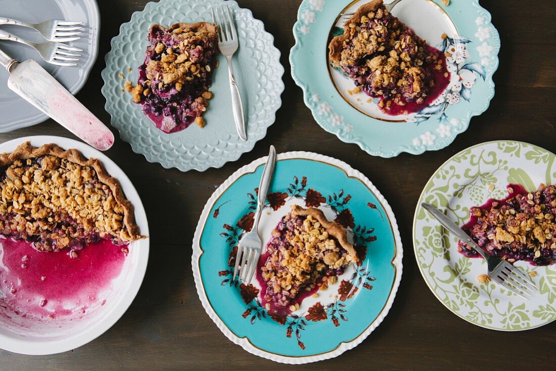 Portions of blueberry pie on plates