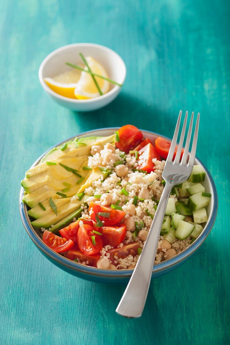 couscous and chickpea salad with avocado, cucumber and tomatoes