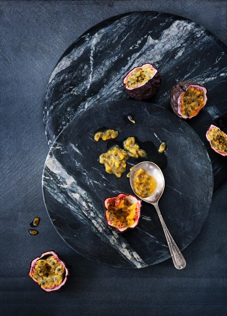 Passion fruit on two marble platters
