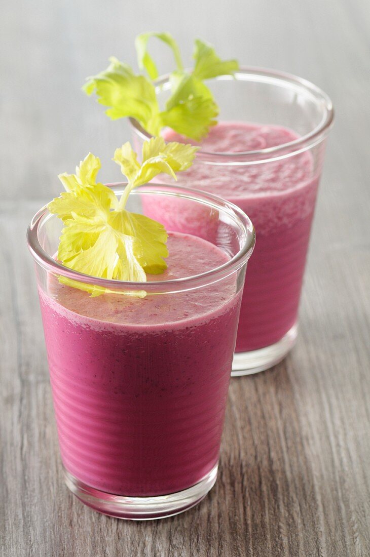 Beetroot smoothies garnished with celery