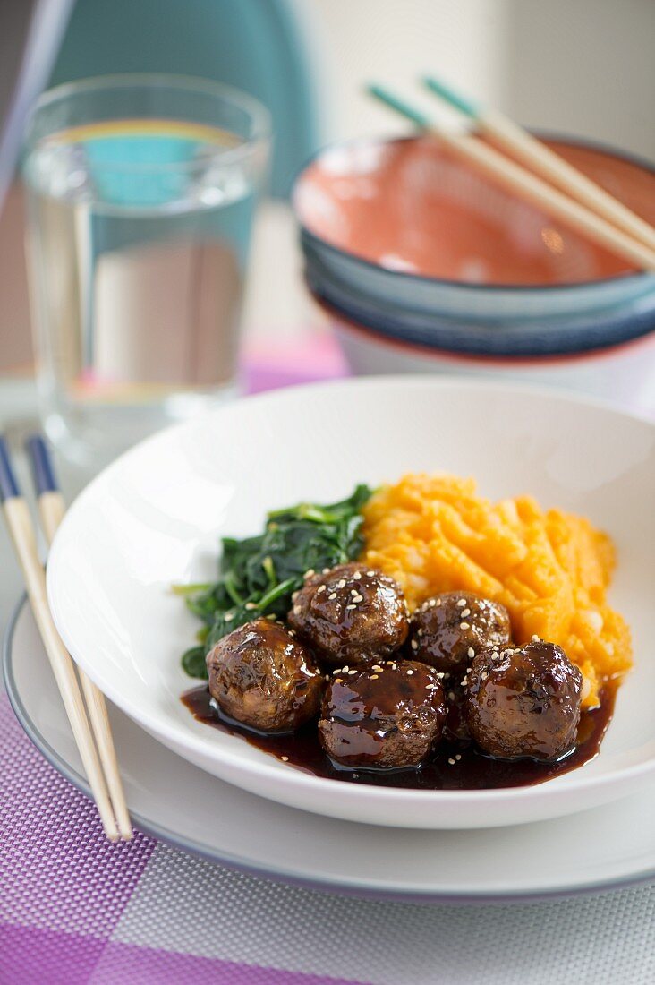 Teriyaki chicken meatballs with mashed sweet potato and baby spinach (Japan)