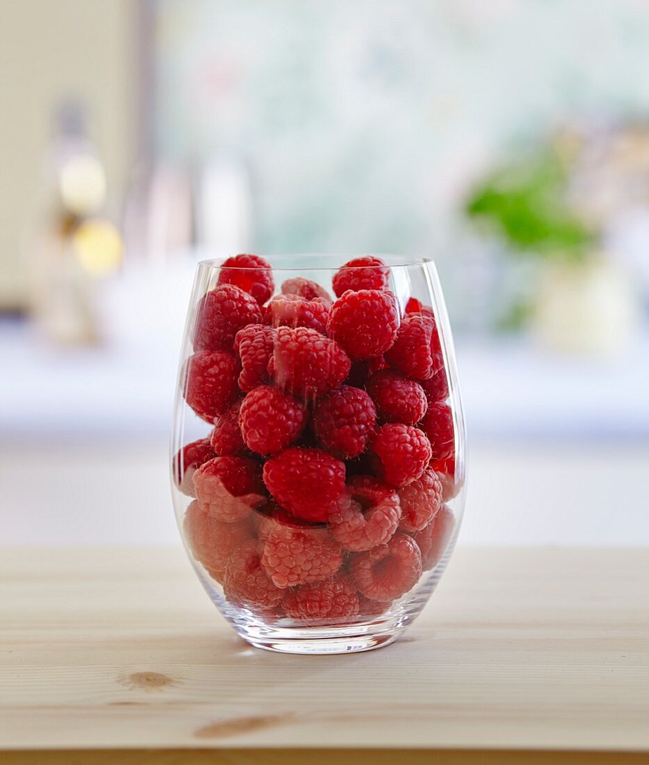 Fresh raspberries in a glass