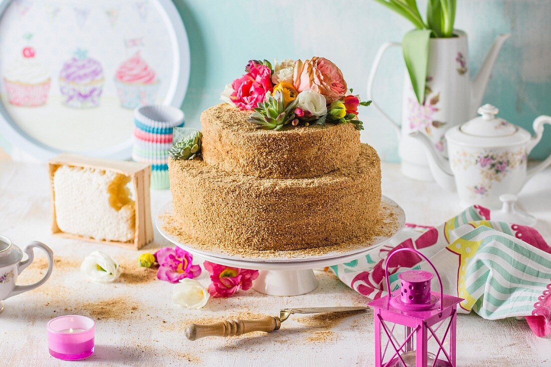 Russian honey cake decorated with colourful flowers