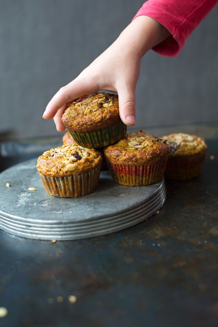 A child taking a turmeric muffin