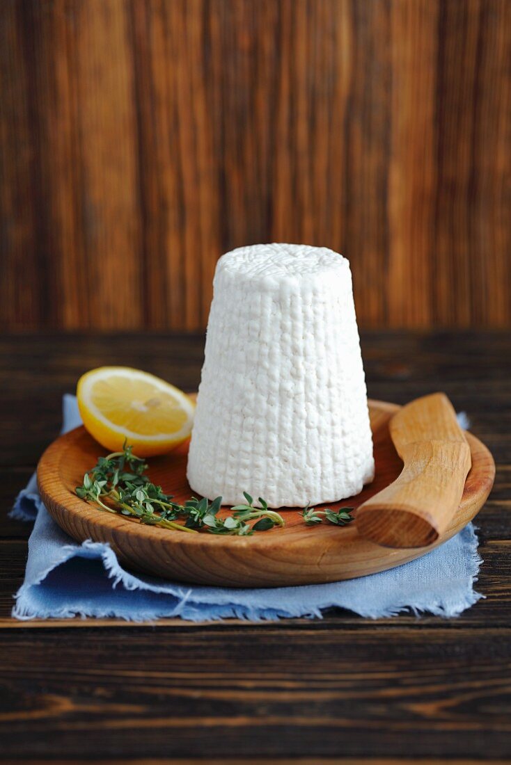 Ricotta cheese on a wooden plate