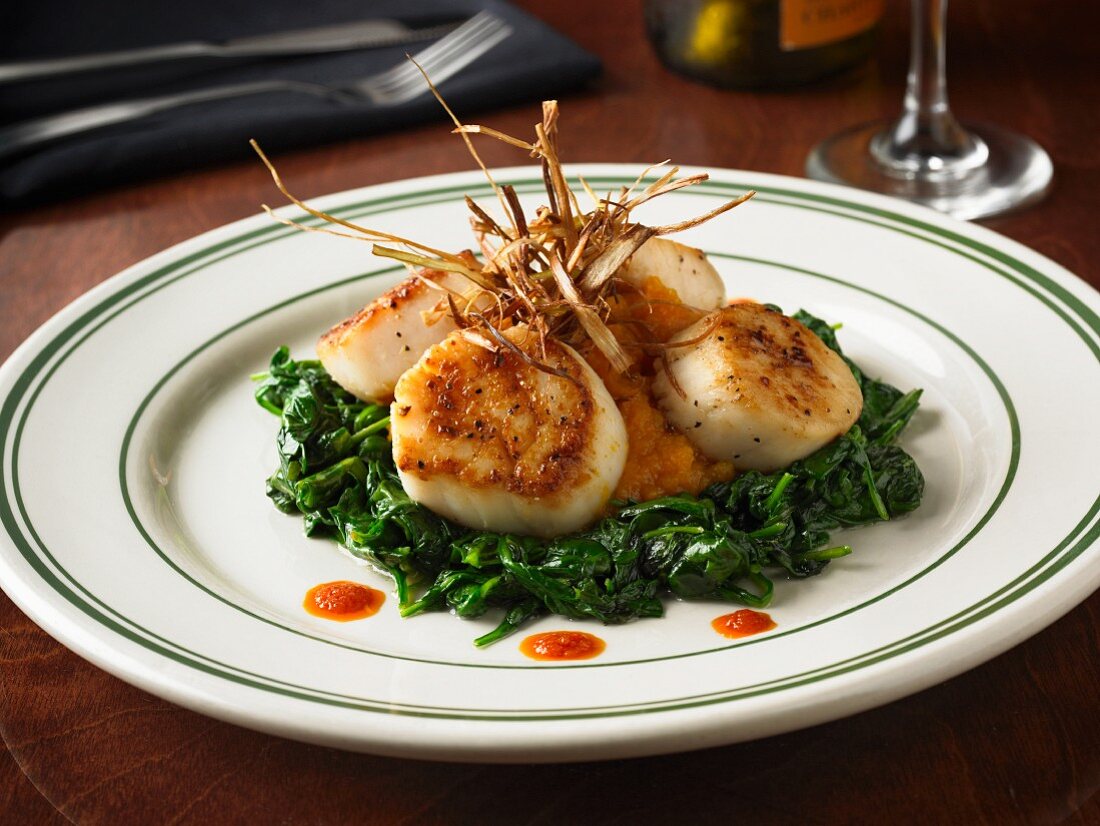 Scallops with spinach and mashed sweet potatoes